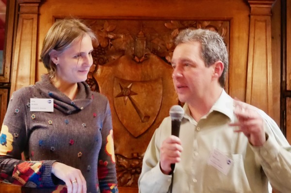 Uta Bunde and Mark Finneran; Mark receiving Triple Crown pin at Christmas party